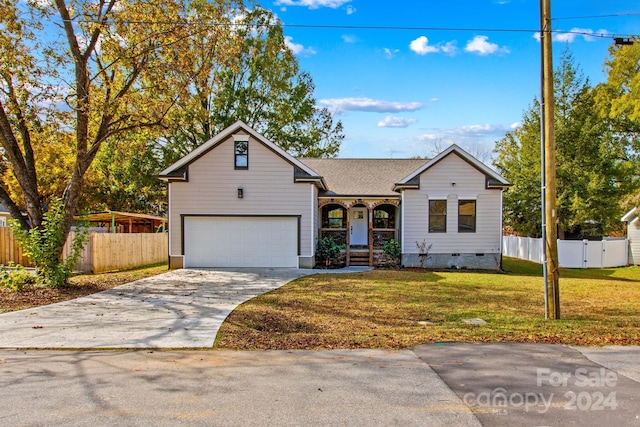 view of front of home featuring a garage and a front lawn