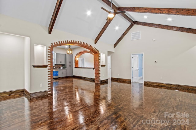 unfurnished living room featuring high vaulted ceiling, dark wood-type flooring, and beamed ceiling