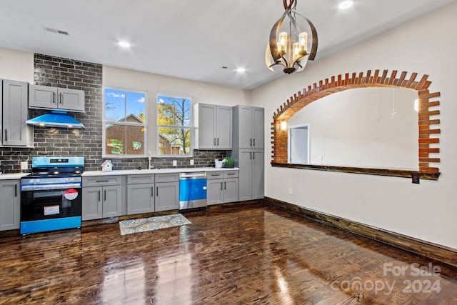 kitchen with gray cabinetry, appliances with stainless steel finishes, and dark hardwood / wood-style floors