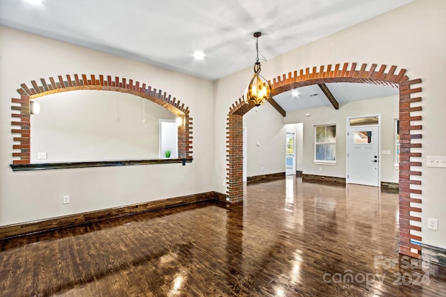 interior space with hardwood / wood-style floors and beamed ceiling