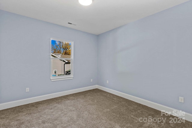 empty room with carpet flooring