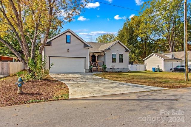 front of property with a garage and a front yard