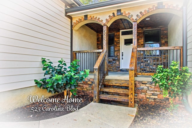 entrance to property featuring a porch