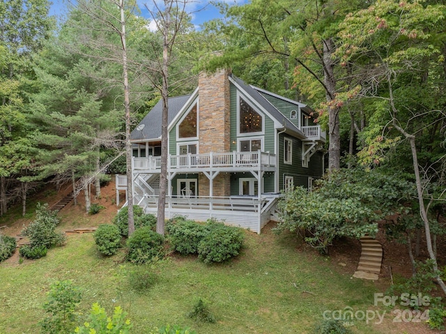 rear view of house with a wooden deck