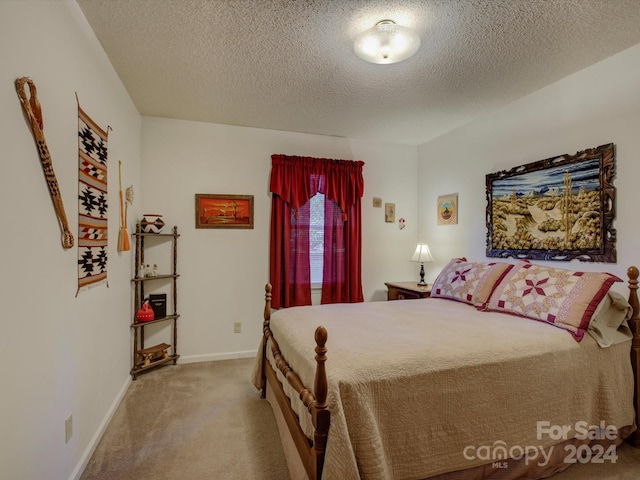 carpeted bedroom with a textured ceiling