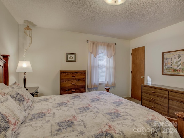 bedroom featuring a textured ceiling