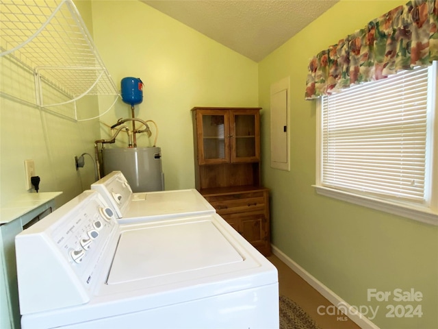 laundry room with washer and clothes dryer, a textured ceiling, electric panel, and water heater