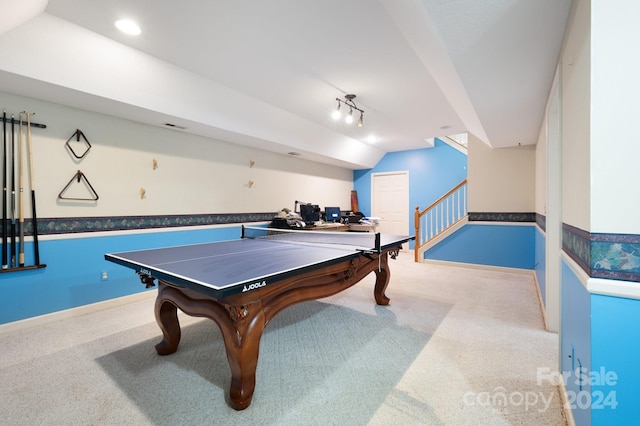 game room with carpet floors, track lighting, and lofted ceiling