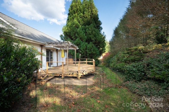 view of yard featuring a pergola and a wooden deck