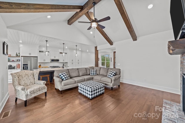 living room featuring high vaulted ceiling, wood-type flooring, beamed ceiling, and ceiling fan