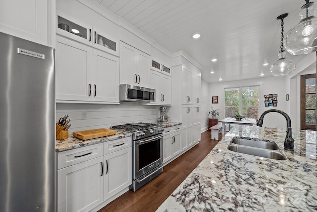 kitchen with white cabinets, stainless steel appliances, and sink