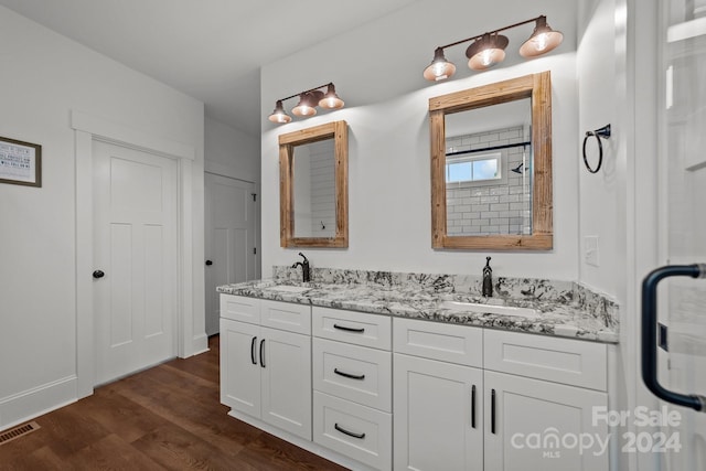 bathroom with hardwood / wood-style flooring and vanity