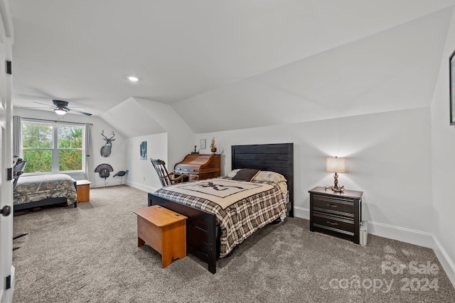 bedroom with ceiling fan, carpet flooring, and lofted ceiling