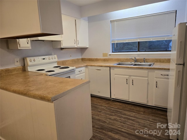 kitchen with white cabinetry, white appliances, sink, and dark hardwood / wood-style floors