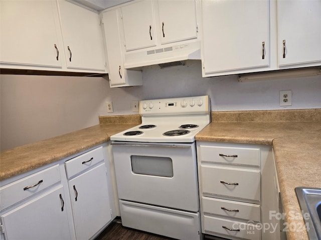 kitchen with white cabinetry, dark hardwood / wood-style floors, white electric range oven, and sink