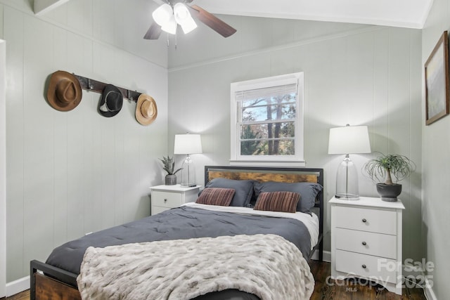 bedroom with ceiling fan, dark hardwood / wood-style floors, and lofted ceiling