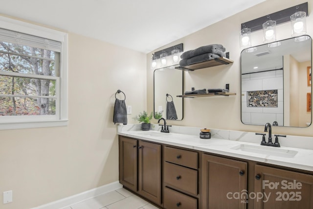 bathroom with tile patterned floors and vanity