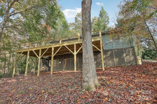 back of property with a wooden deck