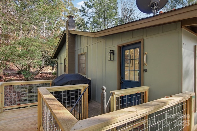 property entrance with a deck