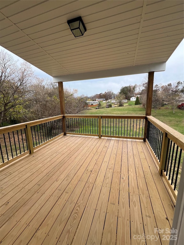 wooden terrace with a yard