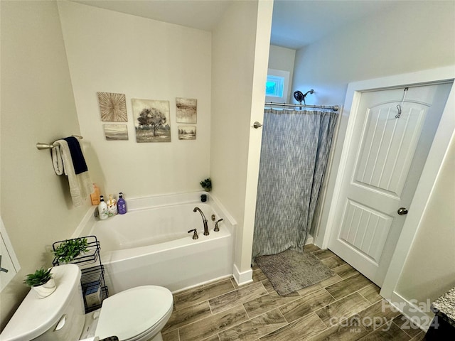 bathroom with toilet, shower with separate bathtub, and hardwood / wood-style flooring