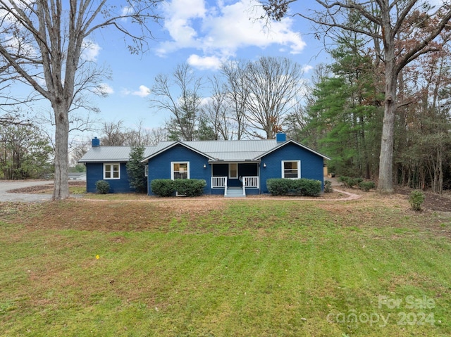 single story home featuring a front yard and covered porch