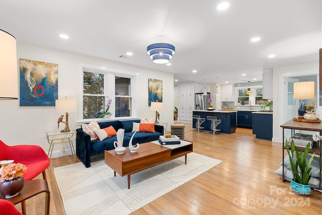 living room with light hardwood / wood-style flooring