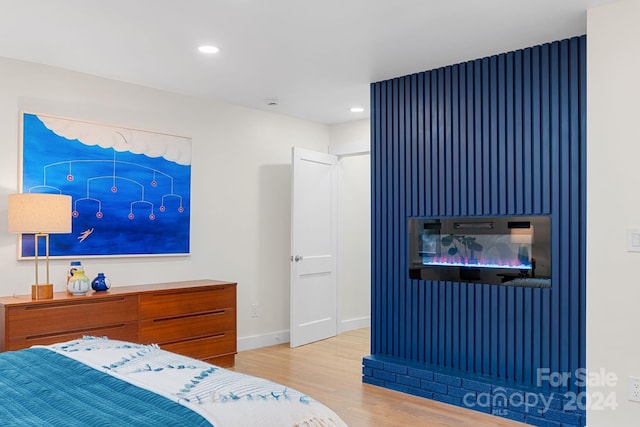 bedroom with light wood-type flooring