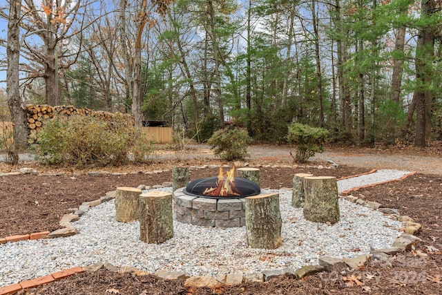 view of yard with an outdoor fire pit