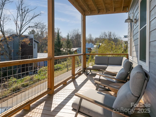 wooden deck featuring an outdoor living space