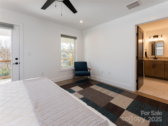 bedroom featuring light wood-type flooring, visible vents, baseboards, and recessed lighting