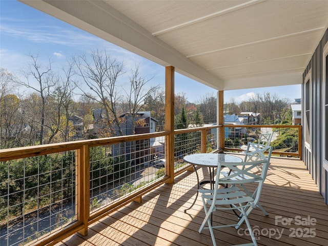 wooden terrace with a residential view