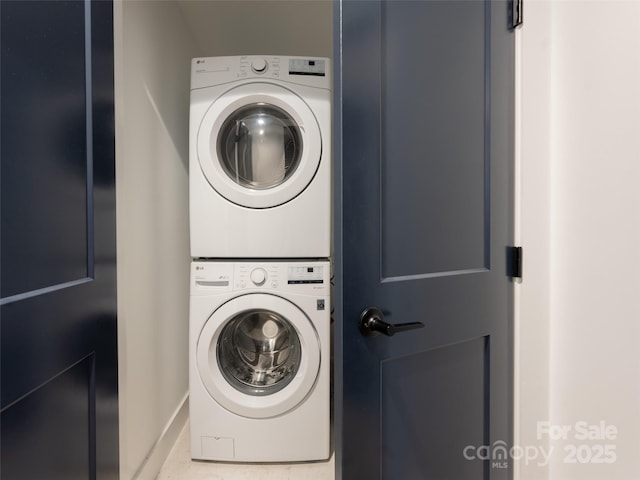 clothes washing area with laundry area and stacked washer / dryer