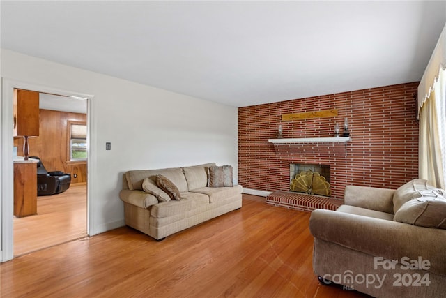 living room featuring hardwood / wood-style flooring and a fireplace