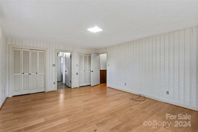 unfurnished bedroom featuring light wood-type flooring