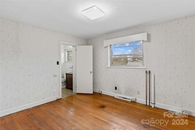 empty room featuring hardwood / wood-style flooring