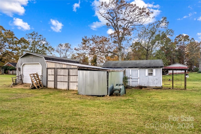 view of outbuilding featuring a lawn