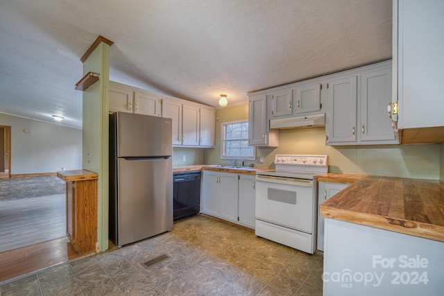 kitchen with dishwasher, electric range, stainless steel fridge, a textured ceiling, and white cabinetry