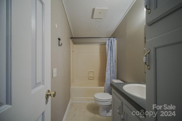 full bathroom with vanity, shower / bath combination with curtain, a textured ceiling, and toilet