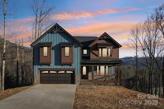 view of front facade with a garage and covered porch