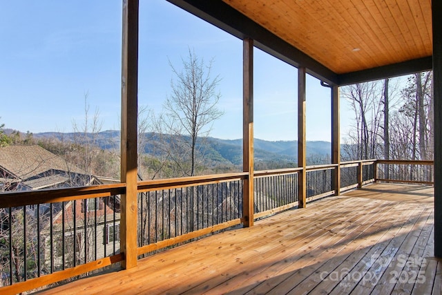 wooden deck featuring a mountain view
