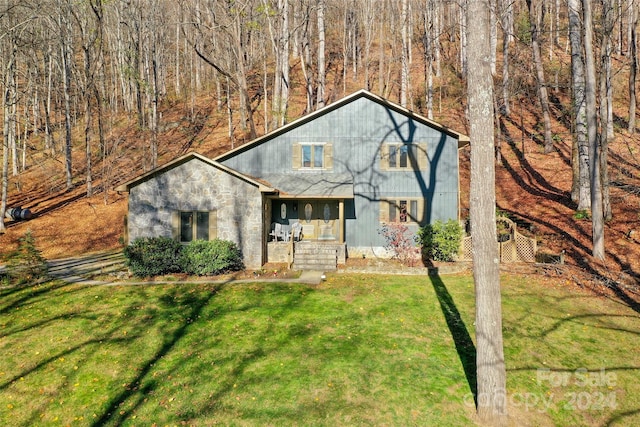 view of front of house with a front lawn and a porch