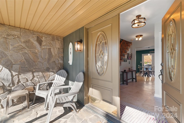 doorway to property featuring covered porch