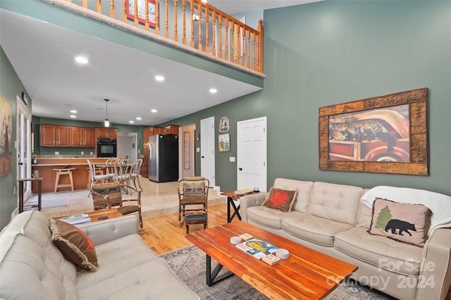 living room with light hardwood / wood-style flooring