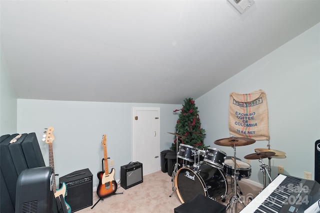 miscellaneous room with light colored carpet and lofted ceiling