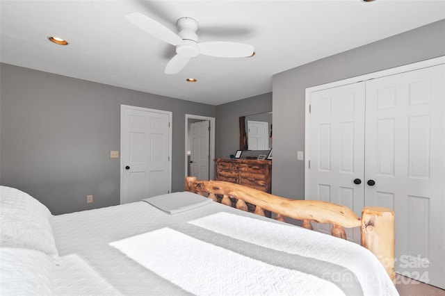 carpeted bedroom with ceiling fan