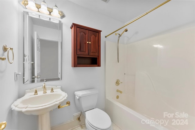 bathroom with toilet and shower / bathing tub combination