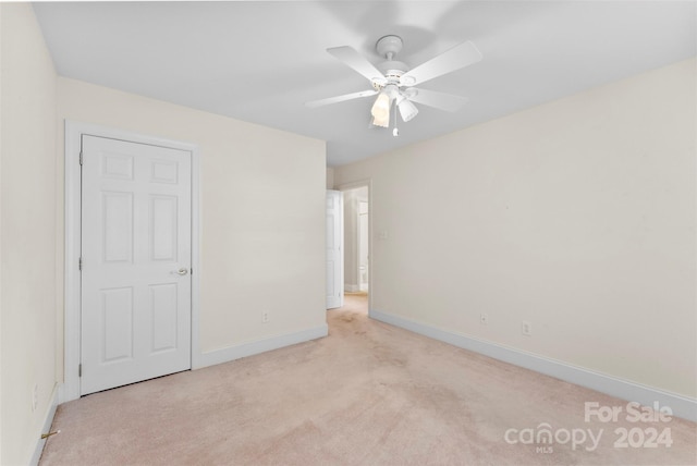 interior space with ceiling fan