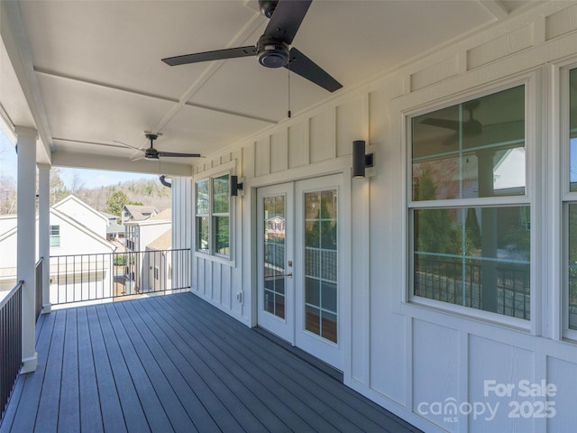 deck featuring french doors and a ceiling fan