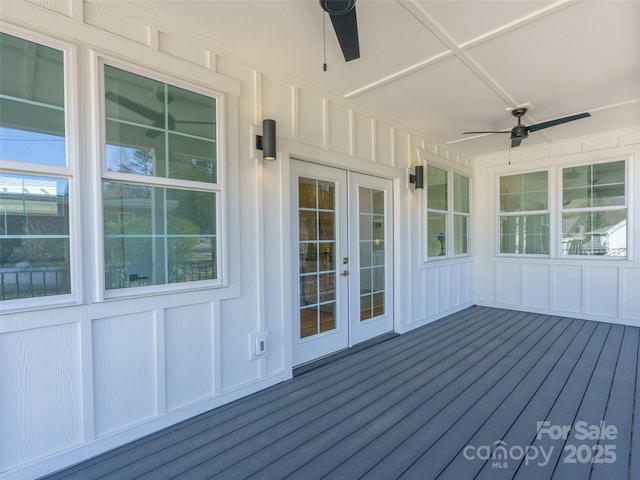 wooden deck featuring french doors and a ceiling fan